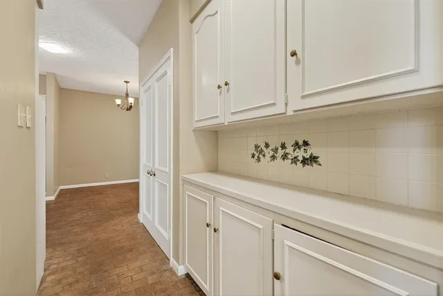 a view of a hallway with closet