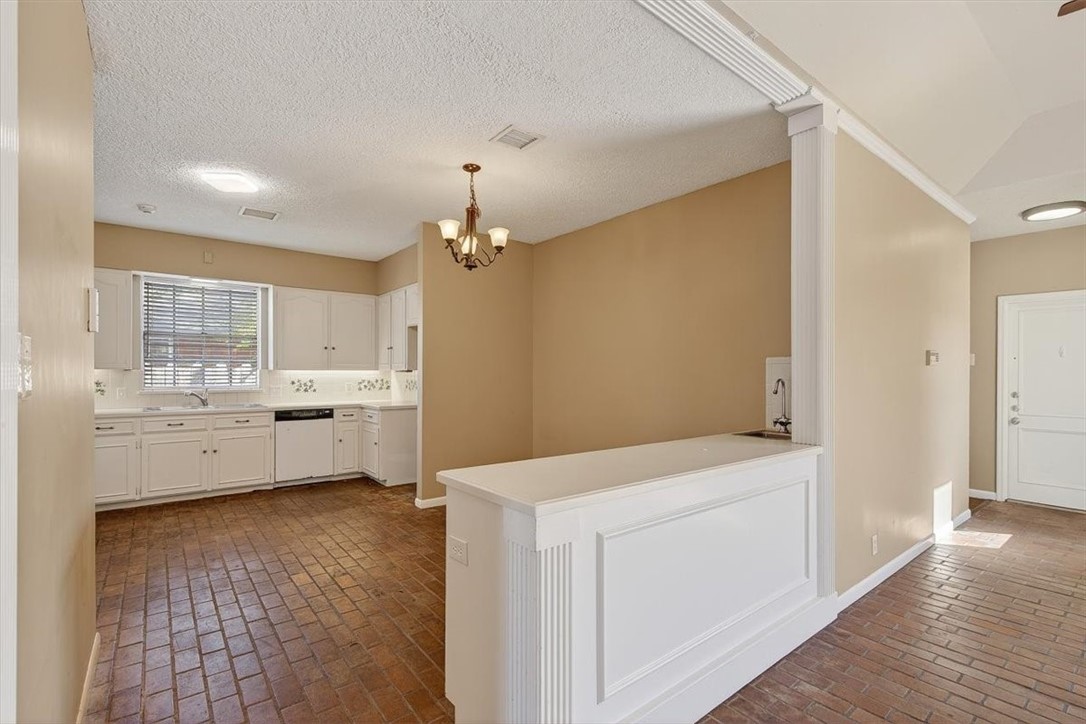 6418 Long Circle Corpus Christi, TX 78413 - Photo 16 of 40 a view of a kitchen with wooden floor and electronic appliances