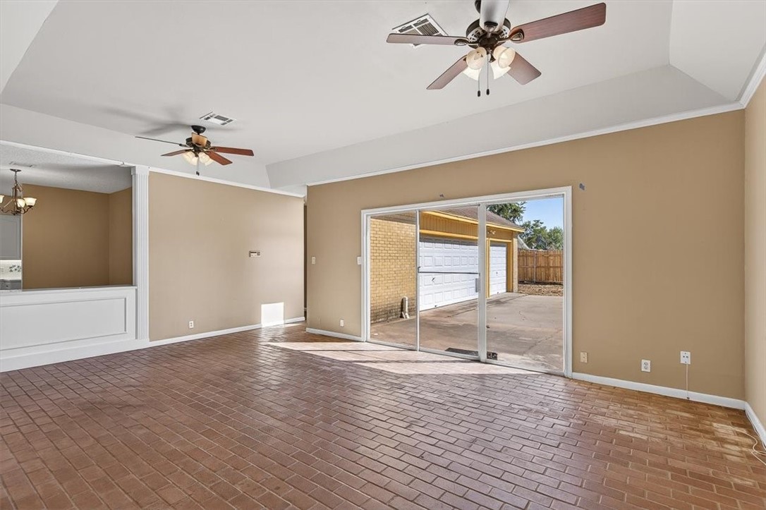 6418 Long Circle Corpus Christi, TX 78413 - Photo 17 of 40 a view of an empty room with window and a ceiling fan