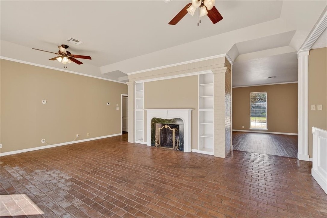 6418 Long Circle Corpus Christi, TX 78413 - Photo 19 of 40 a view of empty room with fan and fireplace