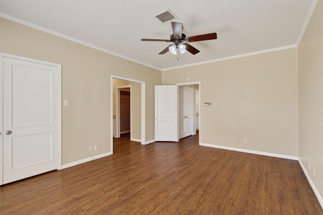 6418 Long Circle Corpus Christi, TX 78413 - Photo 23 of 40 a view of an empty room with wooden floor