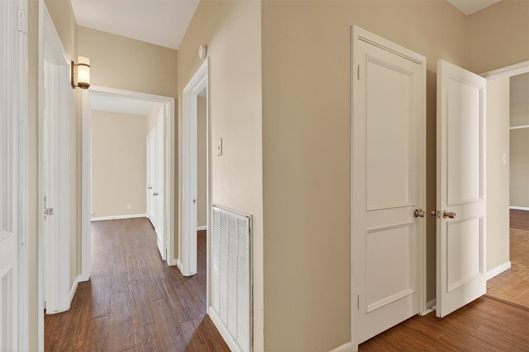 6418 Long Circle Corpus Christi, TX 78413 - Photo 27 of 40 a view of a hallway with wooden floor