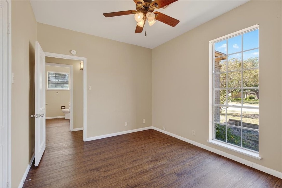 6418 Long Circle Corpus Christi, TX 78413 - Photo 28 of 40 wooden floor in an empty room with a window