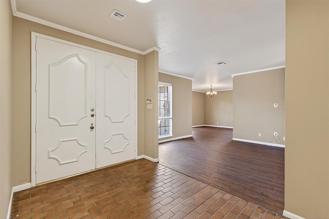 6418 Long Circle Corpus Christi, TX 78413 - Photo 3 of 40 a view of an empty room with wooden floor