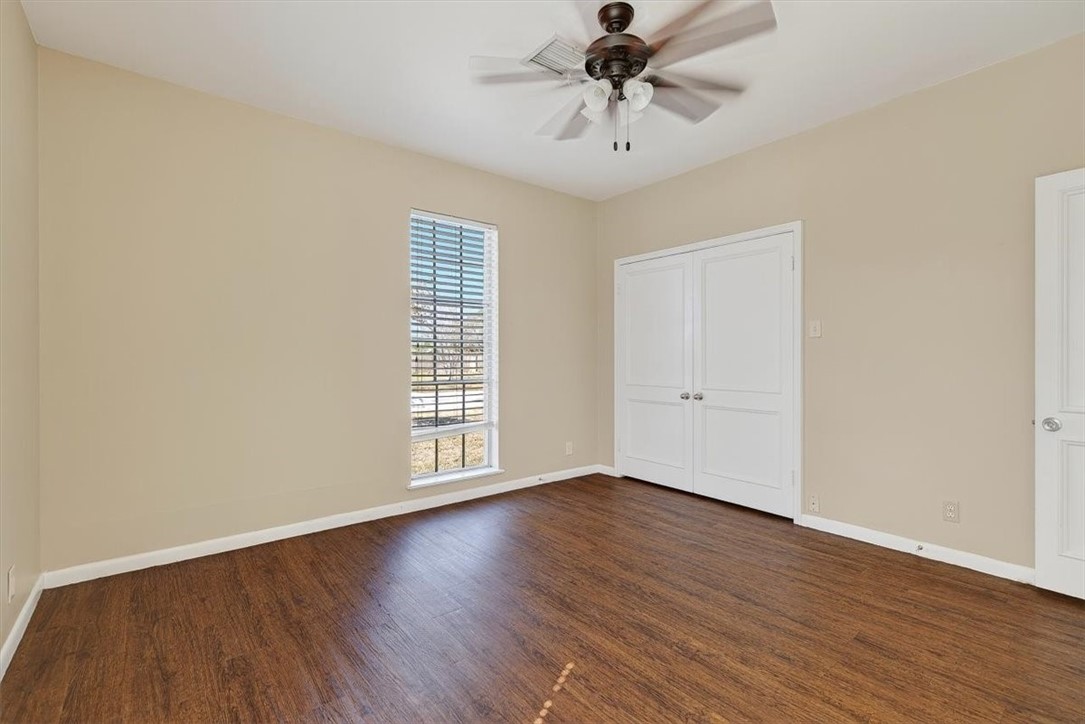 6418 Long Circle Corpus Christi, TX 78413 - Photo 34 of 40 a view of an empty room with wooden floor and a window