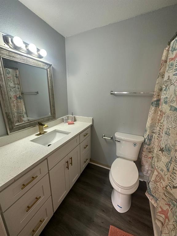 1023 South Hiawassee Road, Unit 4022 Orlando, FL 32835 - Photo 14 of 24 a bathroom with a toilet sink and mirror
