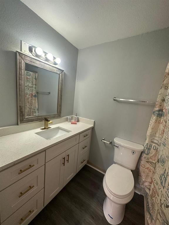 1023 South Hiawassee Road, Unit 4022 Orlando, FL 32835 - Photo 22 of 24 a bathroom with a double vanity sink and a toilet
