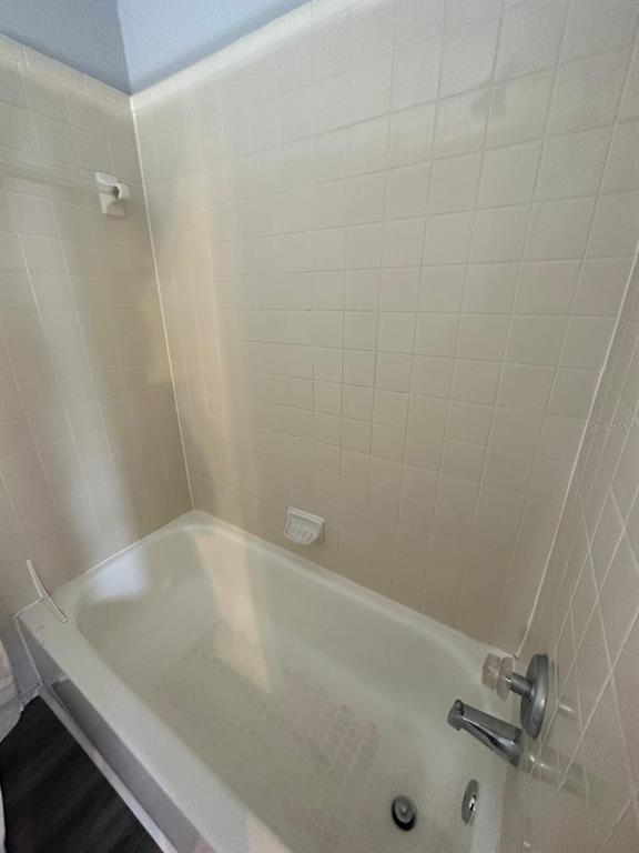 1023 South Hiawassee Road, Unit 4022 Orlando, FL 32835 - Photo 9 of 24 a bathroom with a sink and shower