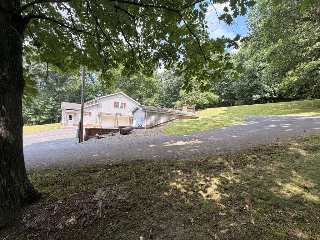 526 East River Road Edinburg, PA 16116 - Photo 8 of 45 a house view with a garden space