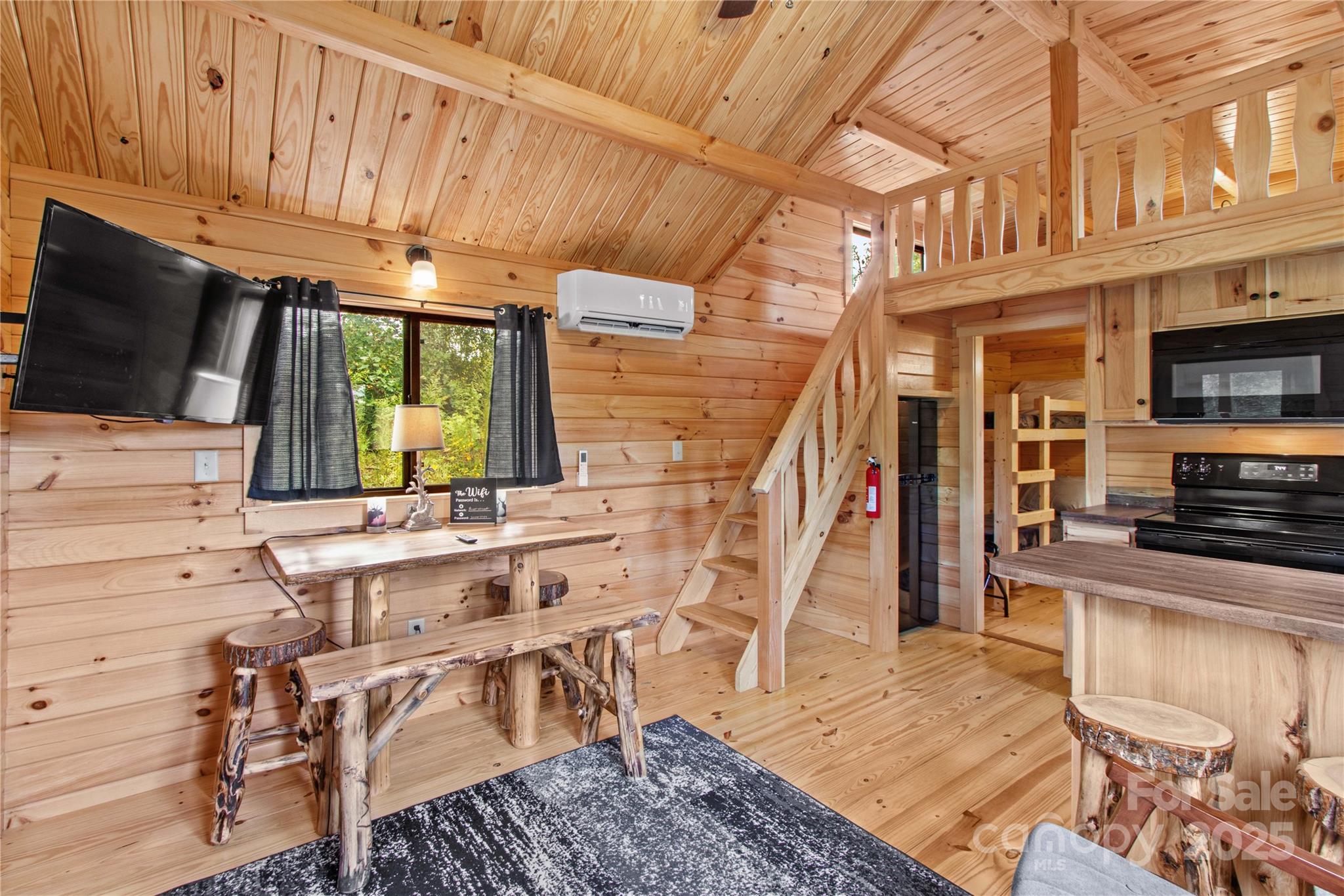 1136 Bauguess Mill Road Traphill, NC 28685 - Photo 11 of 37 a very nice looking room with a large window