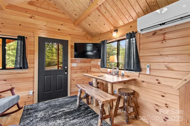 a balcony with furniture and flat screen tv
