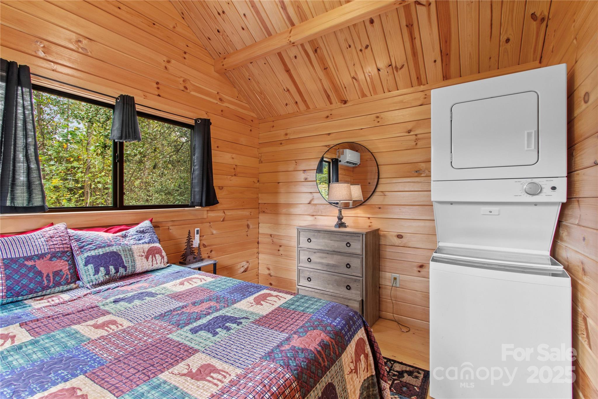 1136 Bauguess Mill Road Traphill, NC 28685 - Photo 16 of 37 a bedroom with a bed and wooden floor