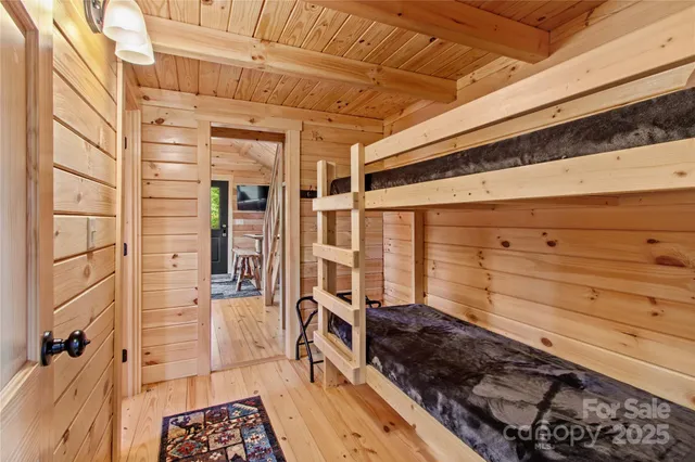 a view of a living room with furniture and a fireplace