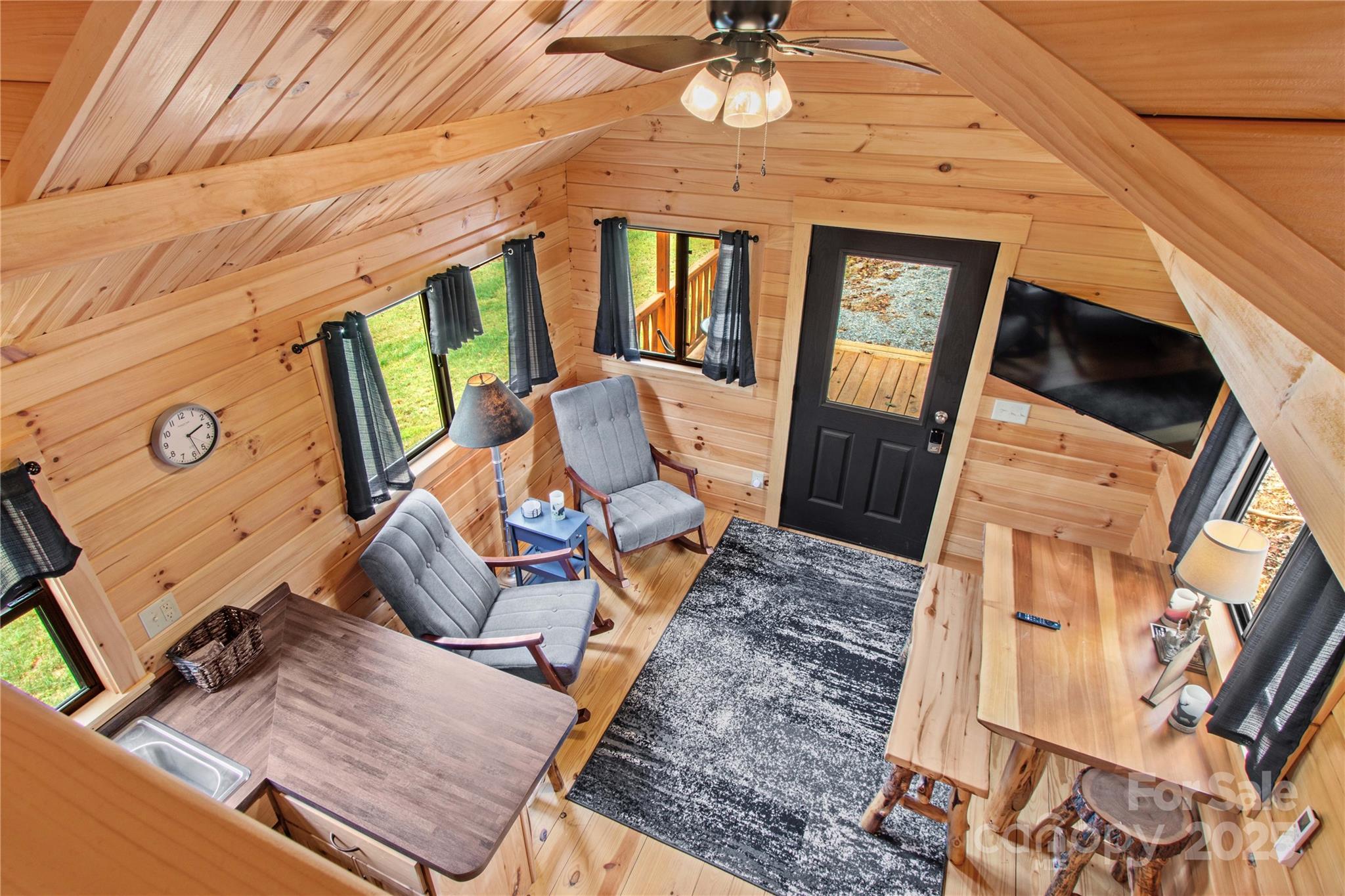 1136 Bauguess Mill Road Traphill, NC 28685 - Photo 20 of 37 a view of a living room with furniture and a fireplace