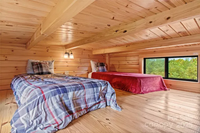 a view of a chair and table in backyard of the house
