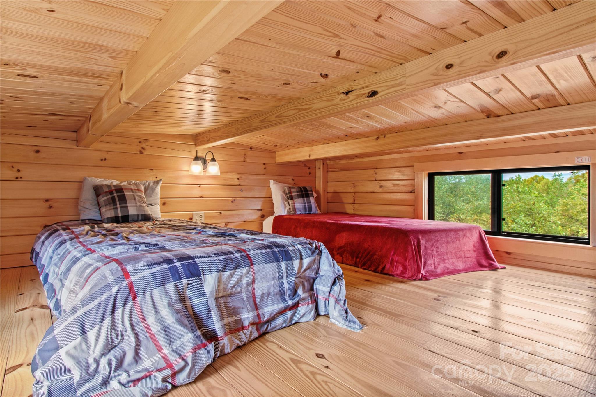 1136 Bauguess Mill Road Traphill, NC 28685 - Photo 21 of 37 a bedroom with a bed and wooden floor