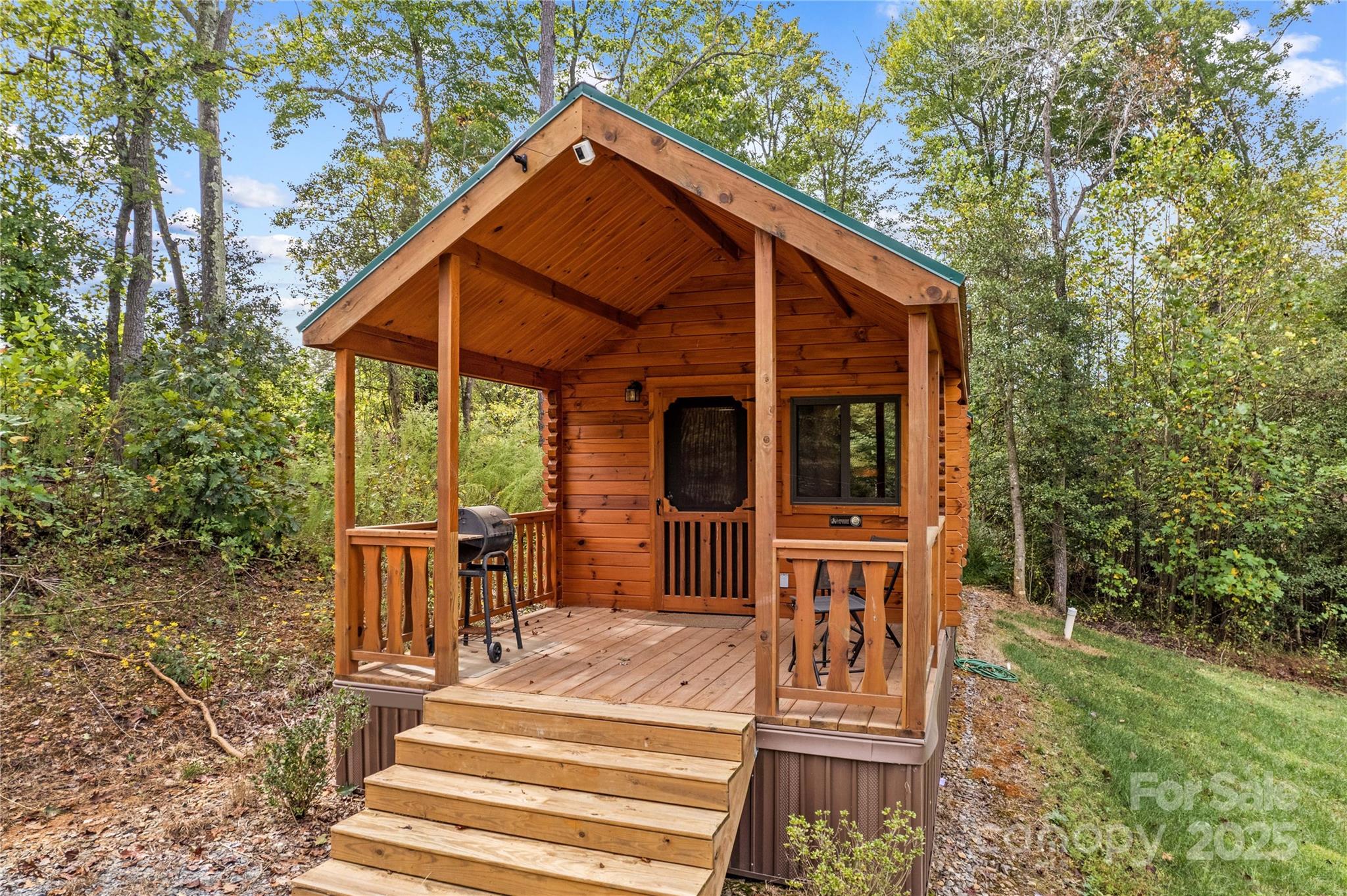 1136 Bauguess Mill Road Traphill, NC 28685 - Photo 22 of 37 a view of a chair and table in backyard of the house
