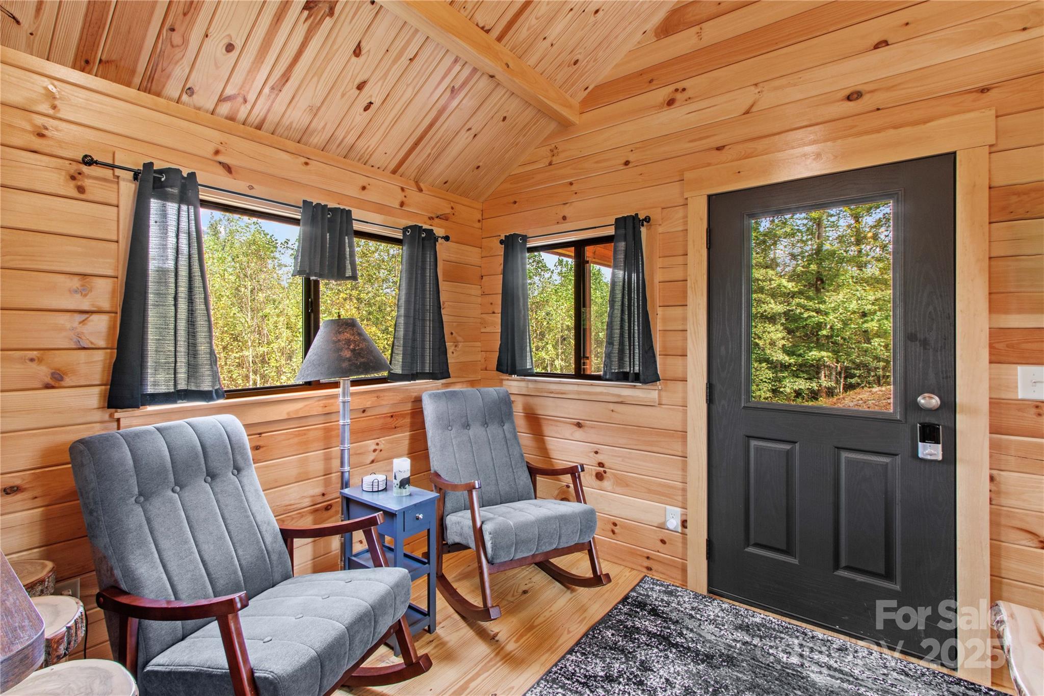 1136 Bauguess Mill Road Traphill, NC 28685 - Photo 5 of 37 a living room with furniture and a large window