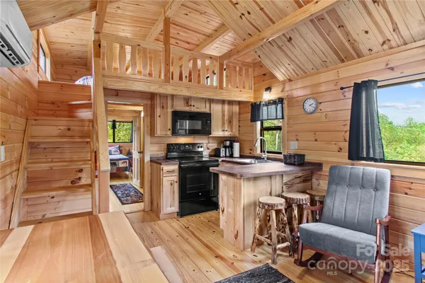 a view of a kitchen with furniture and a kitchen