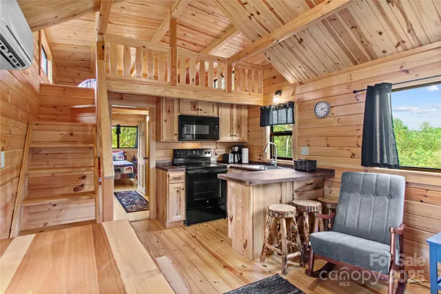 a view of a kitchen with furniture and a kitchen