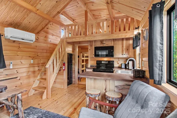 a view of a kitchen with furniture and a kitchen view