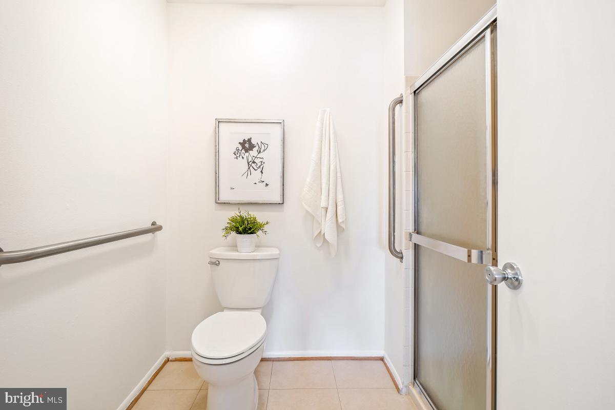 3511 Forest Edge Drive, Unit 173C Silver Spring, MD 20906 - Photo 18 of 52 a bathroom with a toilet and a shower