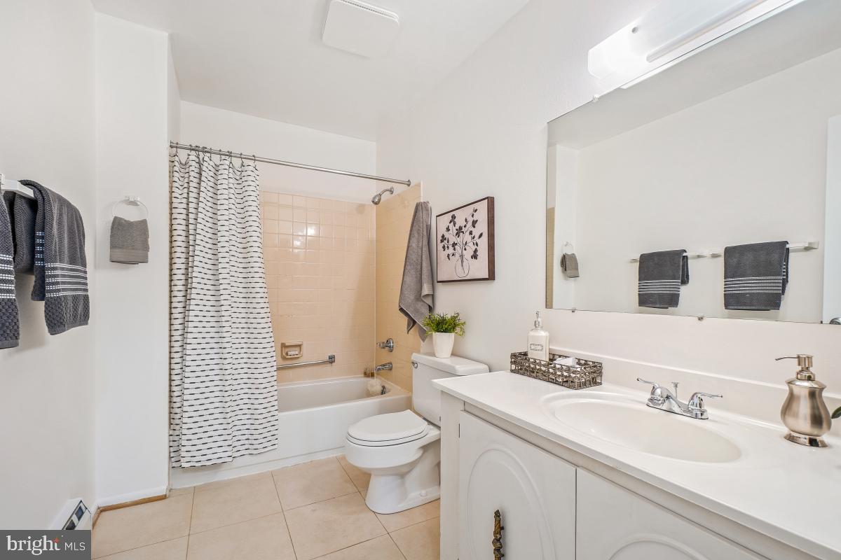 3511 Forest Edge Drive, Unit 173C Silver Spring, MD 20906 - Photo 20 of 52 a bathroom with a sink a toilet and shower