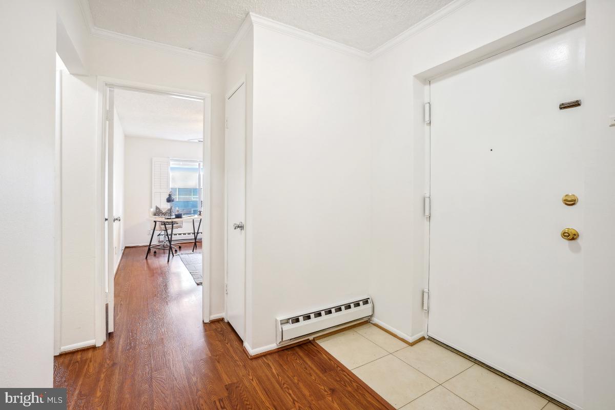 3511 Forest Edge Drive, Unit 173C Silver Spring, MD 20906 - Photo 28 of 52 a view of a hallway with wooden floor