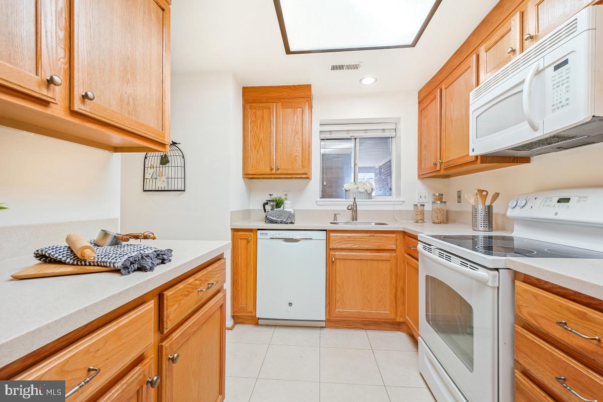 3511 Forest Edge Drive, Unit 173C Silver Spring, MD 20906 - Photo 3 of 52 a kitchen with stainless steel appliances granite countertop a sink and cabinets