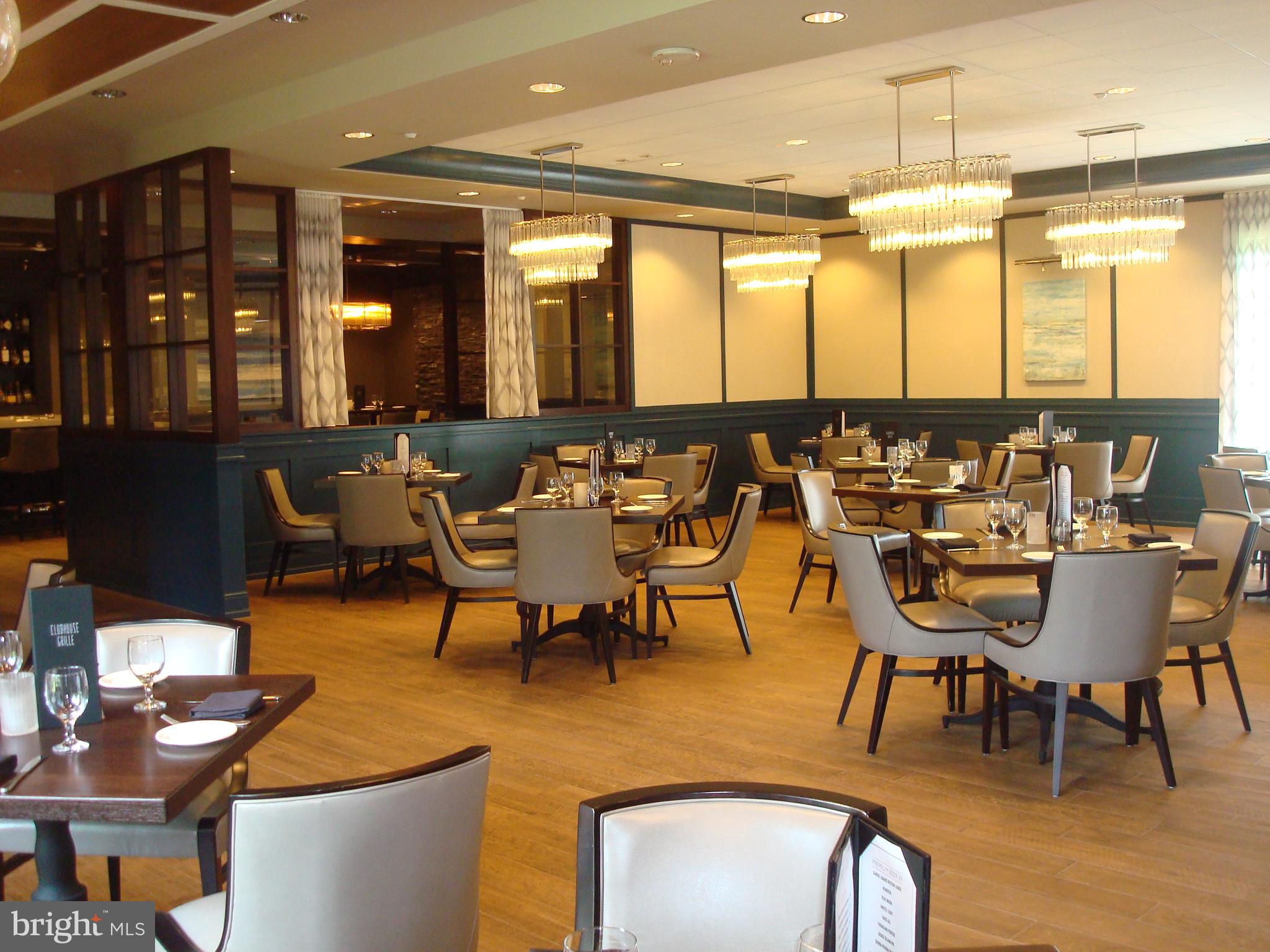 3511 Forest Edge Drive, Unit 173C Silver Spring, MD 20906 - Photo 32 of 52 a view of a dining room with furniture window and wooden floor
