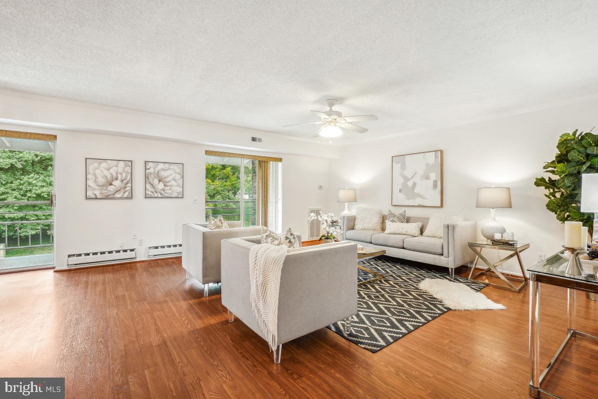 3511 Forest Edge Drive, Unit 173C Silver Spring, MD 20906 - Photo 51 of 52 a living room with furniture and a large window
