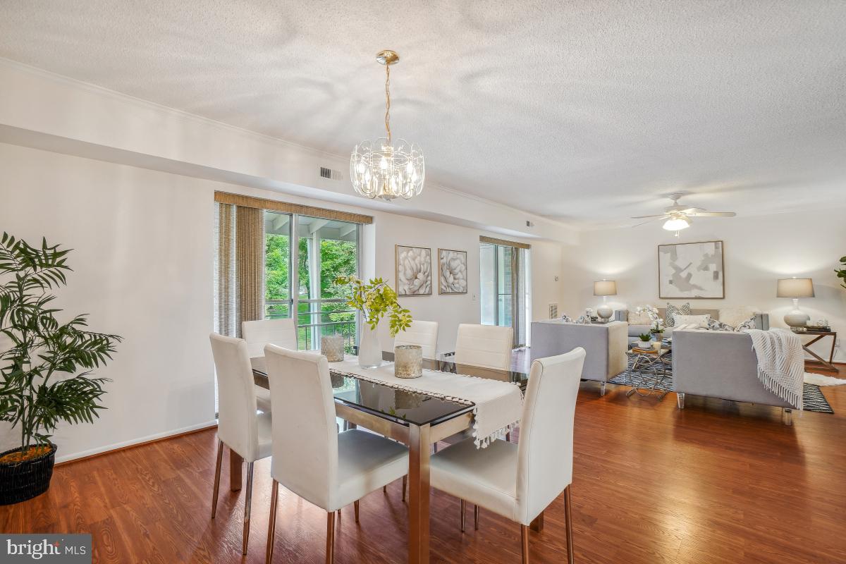 3511 Forest Edge Drive, Unit 173C Silver Spring, MD 20906 - Photo 52 of 52 a view of a dining room with furniture window and wooden floor