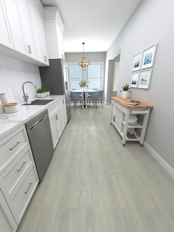 233 Lafayette Street, Unit 9 Salem, MA 01970 - Photo 3 of 6 a living room with furniture and a dining table with wooden floor