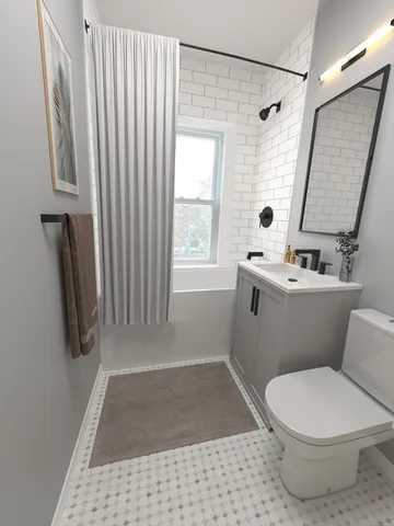 a bathroom with a sink a toilet a window and a shower