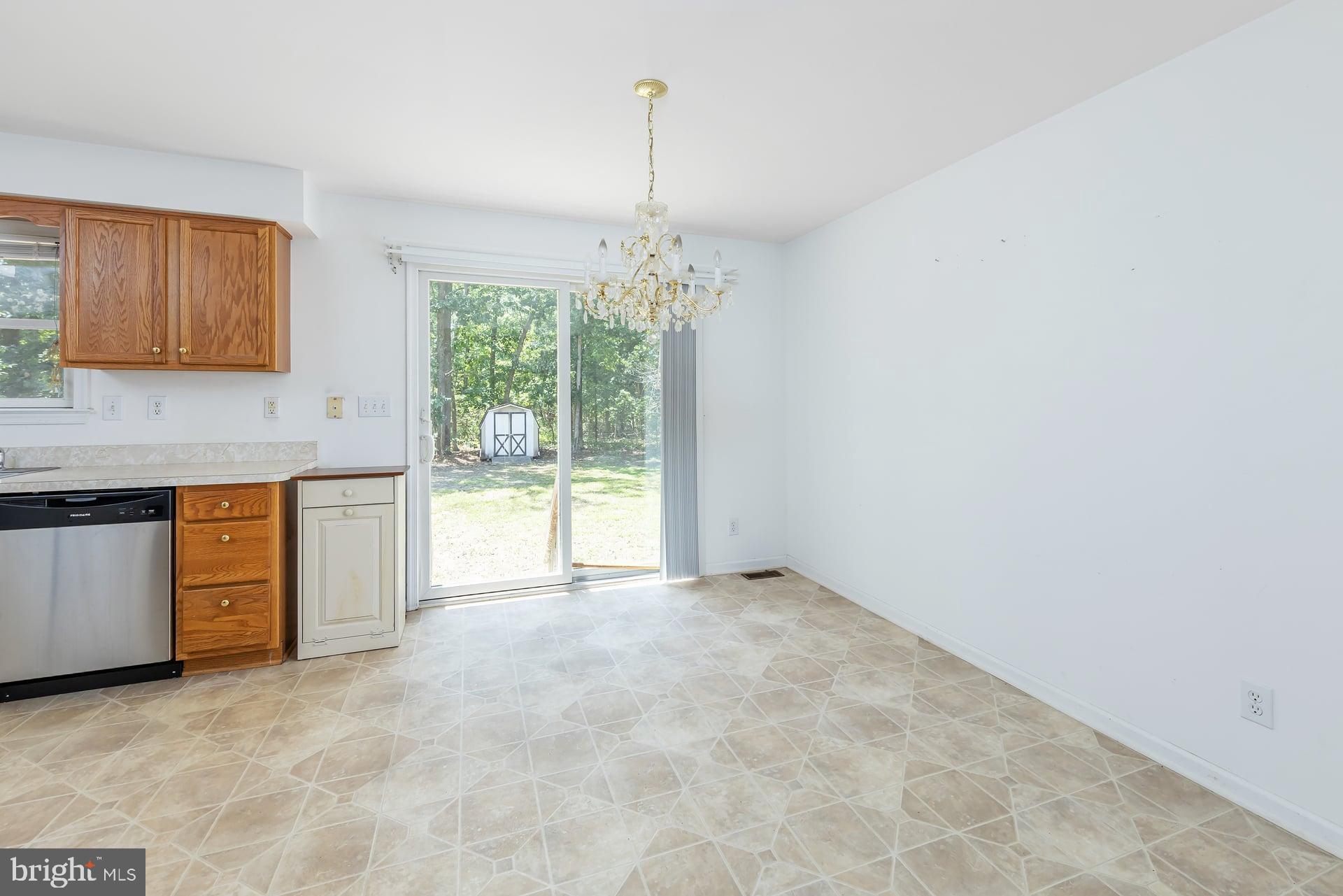 164 Clarks Pond Road Bridgeton, NJ 08302 - Photo 28 of 38 a kitchen with stainless steel appliances granite countertop a stove a sink and a white cabinets