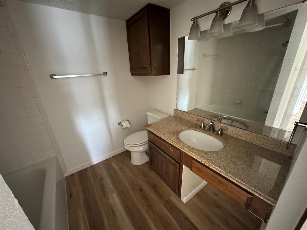 7413 Bogart Drive North Richland Hills, TX 76180 - Photo 5 of 9 a bathroom with a sink and mirror