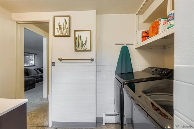 a utility room with closet dryer and washer