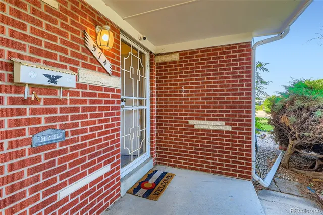 a view of outdoor space with brick wall