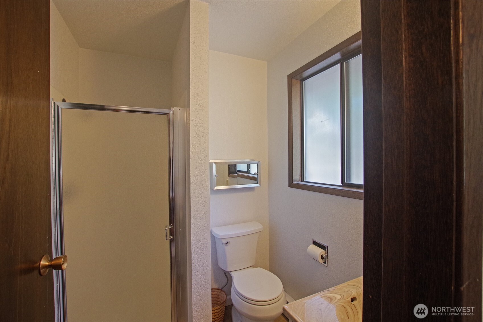 70 Lake Cabins Road Ronald, WA 98940 - Photo 17 of 32 a white toilet sitting next to a bathroom sink