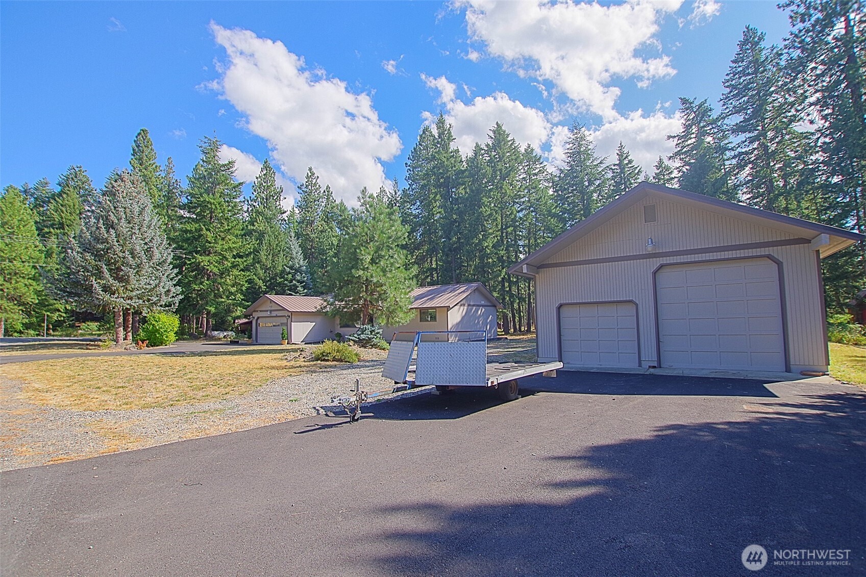 70 Lake Cabins Road Ronald, WA 98940 - Photo 2 of 32 a front view of a house with a yard and garage