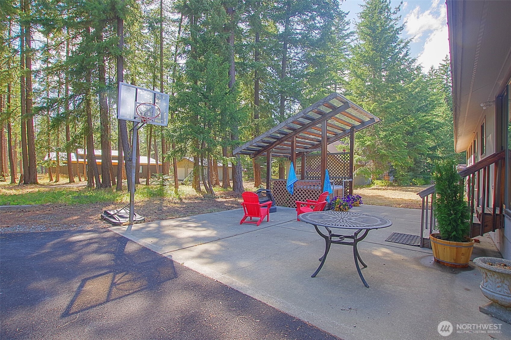 70 Lake Cabins Road Ronald, WA 98940 - Photo 22 of 32 a backyard of a house with barbeque oven table and chairs