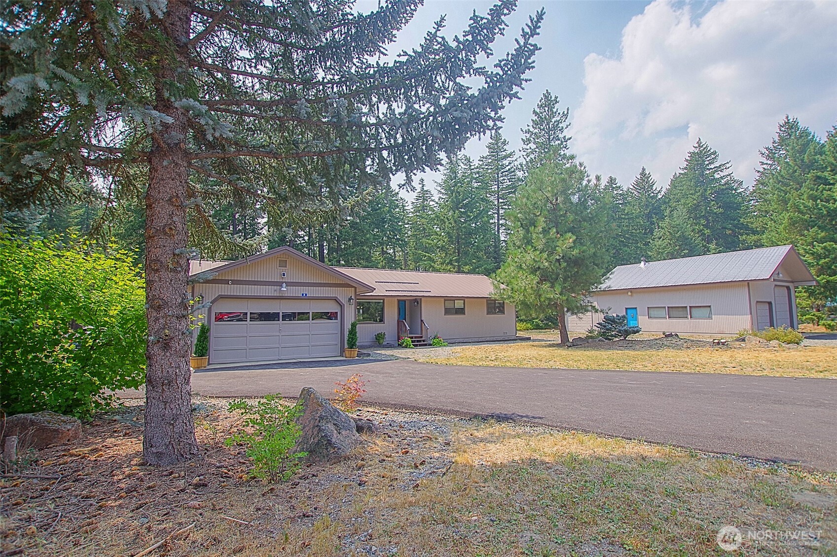 70 Lake Cabins Road Ronald, WA 98940 - Photo 30 of 32 a front view of a house with a yard and garage