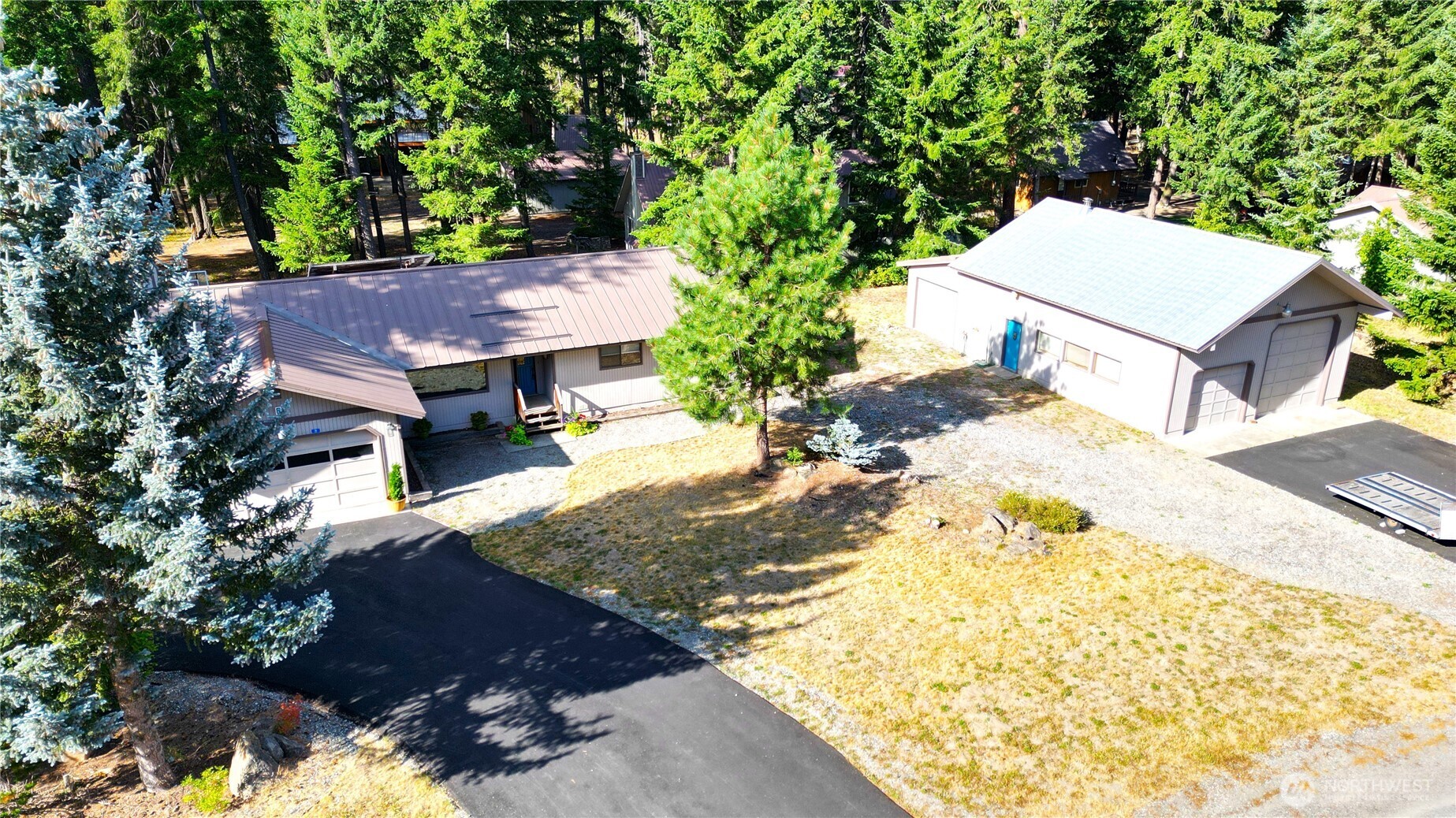 70 Lake Cabins Road Ronald, WA 98940 - Photo 32 of 32 a view of a backyard with a house and large trees