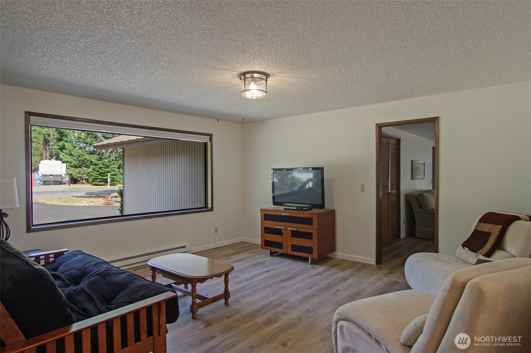 70 Lake Cabins Road Ronald, WA 98940 - Photo 8 of 32 a living room with furniture and a flat screen tv