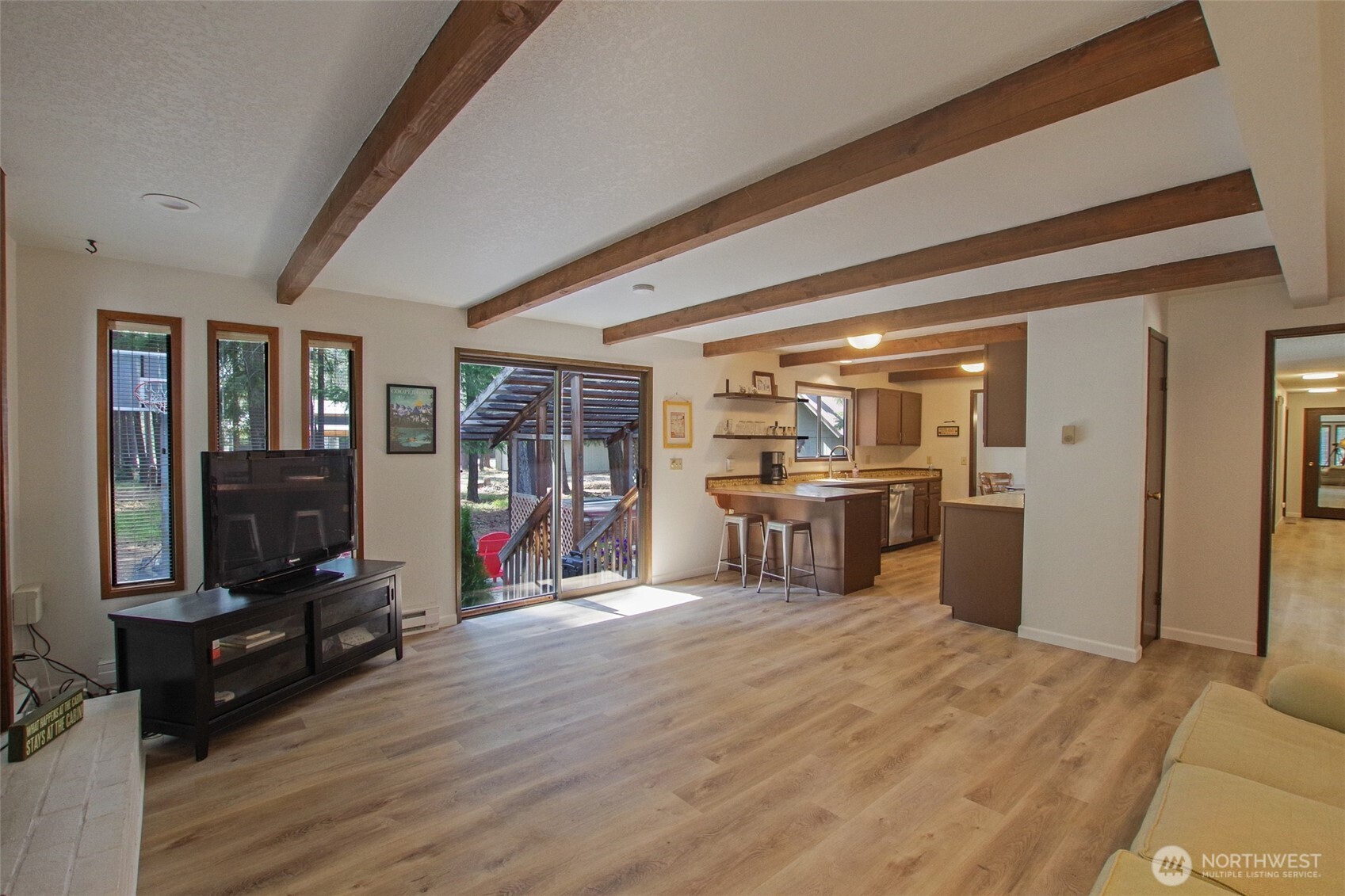 70 Lake Cabins Road Ronald, WA 98940 - Photo 10 of 32 a view of a living room with kitchen furniture and a flat screen tv