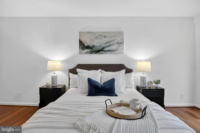 a bedroom with a bed and a couch