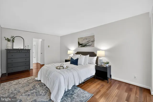 a bedroom with a bed and a dresser