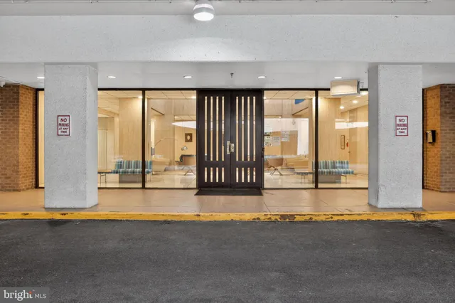 an empty room with large windows