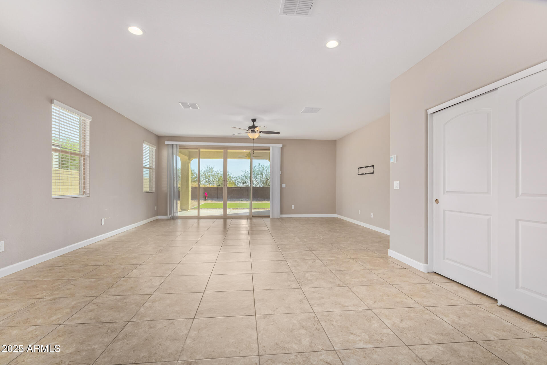 29421 West Mitchell Avenue Buckeye, AZ 85396 - Photo 11 of 40 a view of an empty room with a window