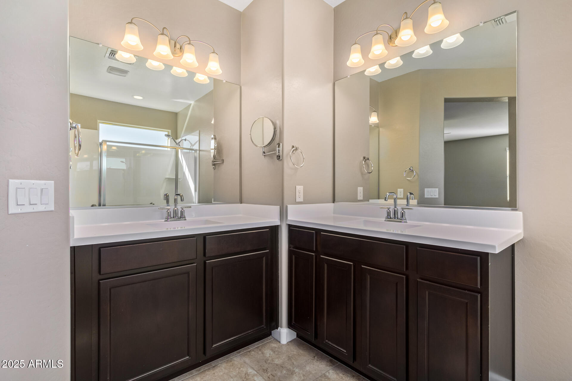 29421 West Mitchell Avenue Buckeye, AZ 85396 - Photo 17 of 40 a bathroom with double vanity and a mirror